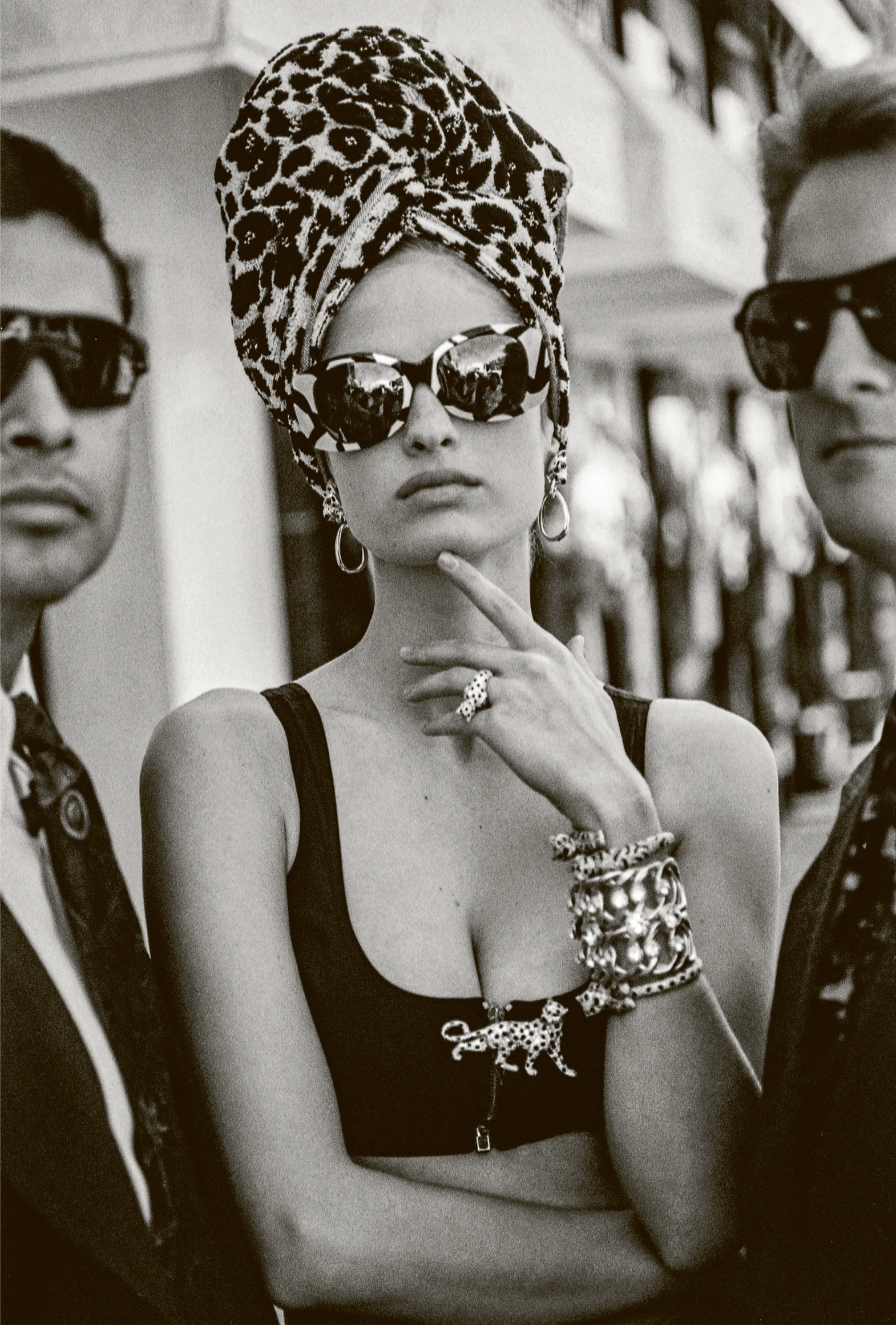 Model wearing Cartier Panthère earrings, ring, bracelets and brooch, photographed by Arthur Elgort. Photograph published in Vogue Italia, March 1992
